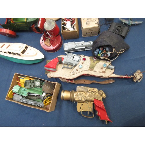 49 - A quantity of toys including clockwork tinplate Steam Roller, Penguin, plastic Motor Boat, Pistols, ... 