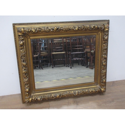 34 - A 19th Century gilt framed Wall Mirror with relief fruit and wheat decoration 3ft 2in W x 2ft 8in H,... 