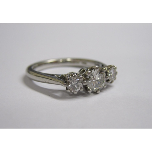 159 - A Diamond three stone Ring claw-set graduated brilliant-cut stones, estimated total weight 0.75cts, ... 