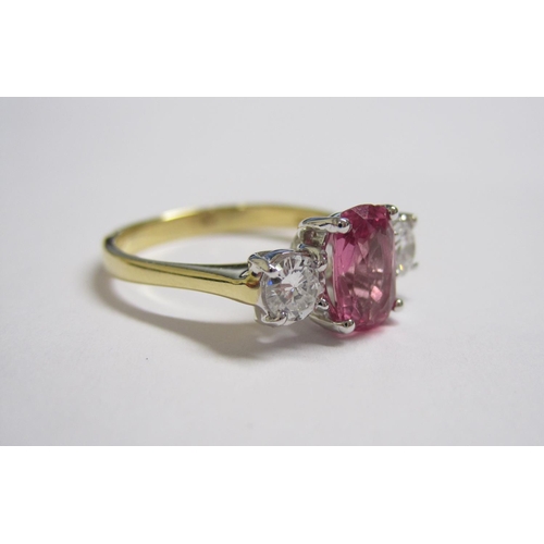 163 - A Pink Sapphire and Diamond three stone Ring claw-set oval-cut sapphire 1.36cts between two brillian... 