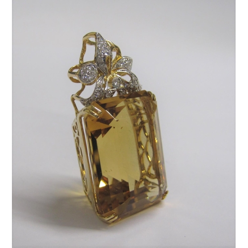 169 - A large Citrine and Diamond Pendant corner claw-set step-cut citrine, 60.50cts, below bow surmount p... 