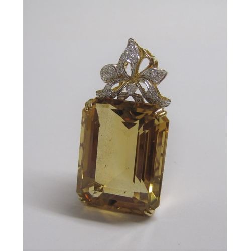 169 - A large Citrine and Diamond Pendant corner claw-set step-cut citrine, 60.50cts, below bow surmount p... 