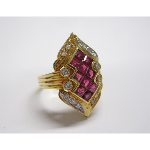 172 - A Ruby and Diamond Cocktail Ring, the lozenge shaped plaque invisibly-set ten step-cut rubies within... 