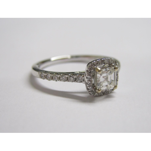 177 - A Diamond halo Cluster Ring corner claw-set asscher-cut stone within pave-set brilliant-cut stones i... 