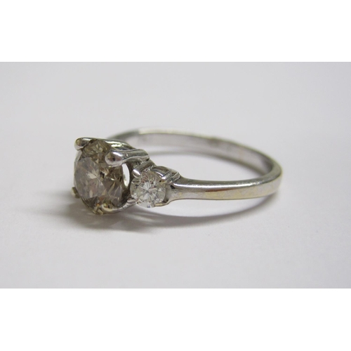 182 - A Fancy Diamond three stone Ring claw-set brilliant-cut champagne coloured stones in 18ct white gold... 