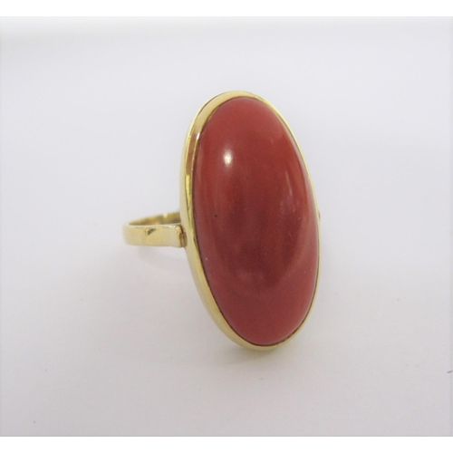 197 - An 18ct gold Ring set oval coral cabochon, ring size R