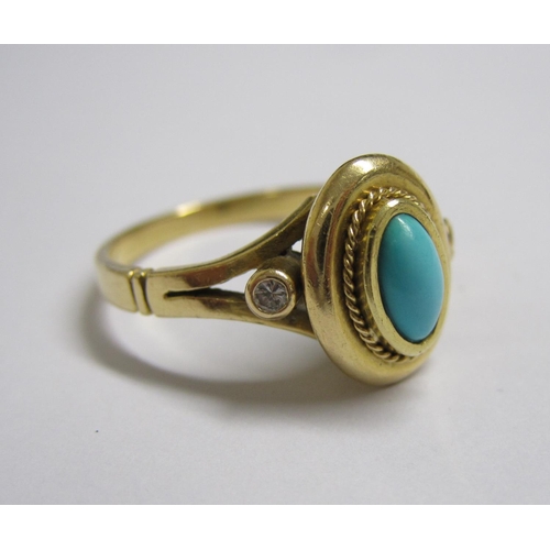 200 - A Turquoise and Diamond Ring set oval turquoise cabochon between two rubover-set brilliant-cut diamo... 