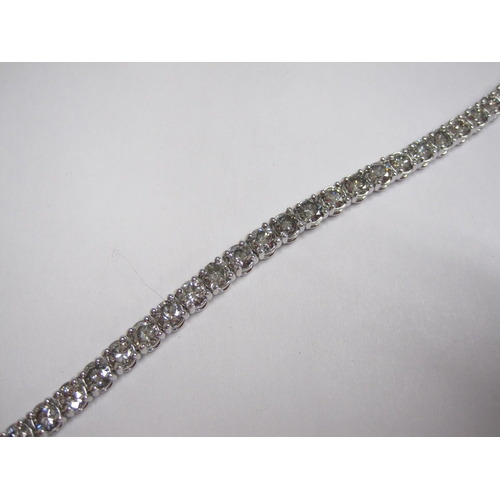 218 - A Diamond Tennis Bracelet having forty two flexible links each set with a brilliant-cut diamond on h... 