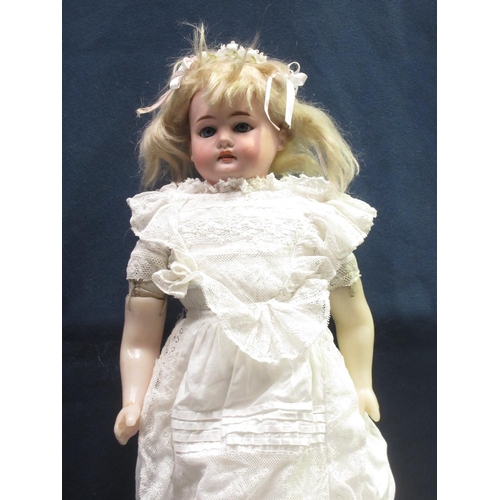 77 - An early bisque shoulder-headed Doll by Armand Marseille with soft body and wax lower limbs, blue sl... 