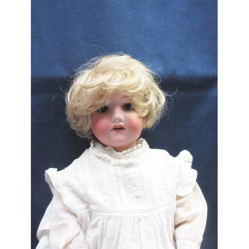 78 - An Armand Marseille bisque headed Doll in night dress