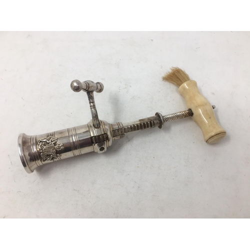 250 - A plated Rack and Pinion Corkscrew with applied coat of arms, turned bone handle and brush.