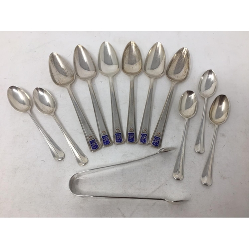 276 - Six George VI silver and blue enamel Coronation Spoons, Sheffield 1936, five Coffee Spoons and Sugar... 