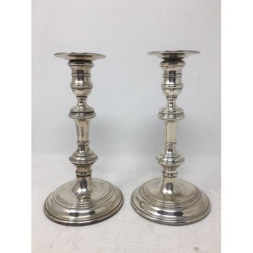 279 - A pair of Elizabeth II silver Candlesticks on circular base, London 1963, 8 1/2 in.