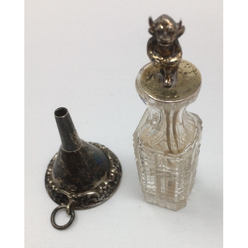 293 - A George V small silver Scent Bottle Funnel, London 1929, and a glass Scent Bottle with silver spatu... 