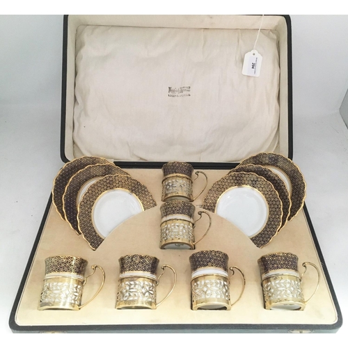 294 - Six Aynsley Coffee Cans with wide blue and gilt borders with pierced silver holders, Birmingham 1927... 