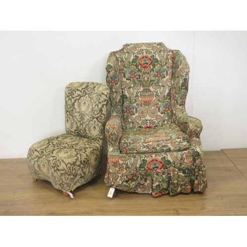 107 - A Wingback Armchair with floral loose covers and an upholstered Bedroom Chair.