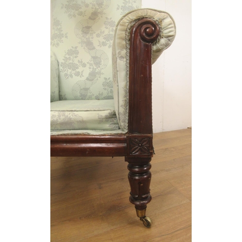 128 - A William IV mahogany Armchair with scrolled arms and turned supports