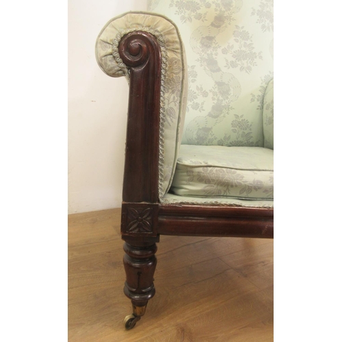 128 - A William IV mahogany Armchair with scrolled arms and turned supports