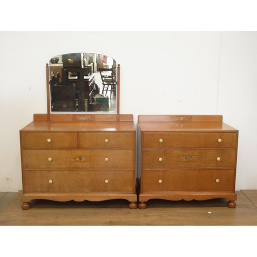 18 - A 20th Century oak and inlaid Bedroom Suite comprising two door Wardrobe, Dressing Chest, Chest of d... 