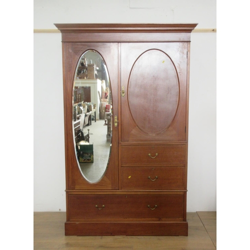 20 - An Edwardian mahogany and inlaid single mirror door compactum Wardrobe fitted oval panel door above ... 