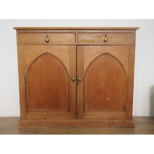 354 - A Victorian pine Cupboard fitted two drawers above pair if arched panel doors 4ft 1in W