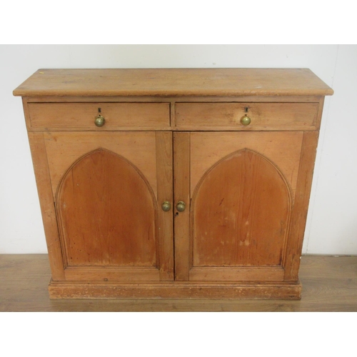 354 - A Victorian pine Cupboard fitted two drawers above pair if arched panel doors 4ft 1in W