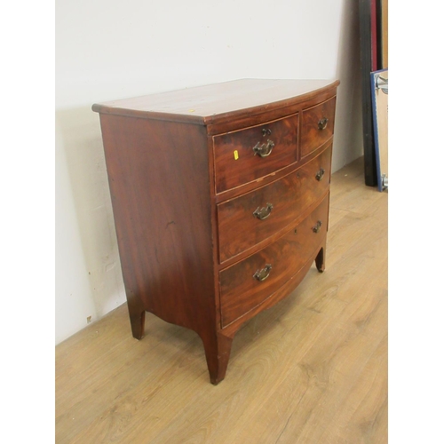 365 - A 19th Century mahogany bow fronted Chest of two short and two long drawers mounted upon splayed fee... 