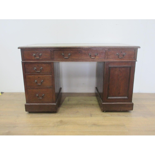 387 - An Edwardian oak Desk with leather inset writing surface fitted cupboard and six drawers mounted upo... 