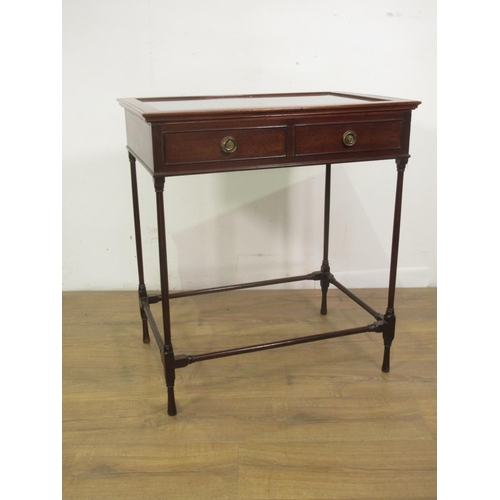 393 - A mahogany Table Display Cabinet with hinged glass lid enclosing a divided interior mounted upon tur... 