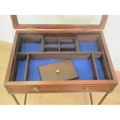 393 - A mahogany Table Display Cabinet with hinged glass lid enclosing a divided interior mounted upon tur... 