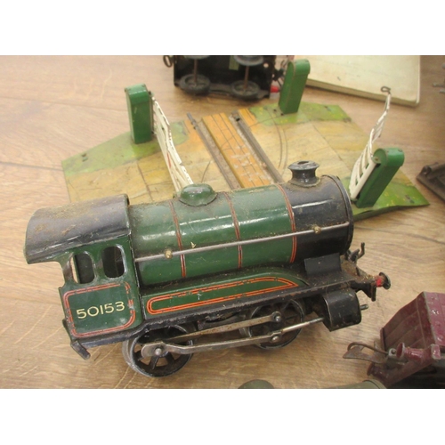 436 - A box of Hornby 0 gauge Clockwork including a Locomotive and tender, Level Crossing and Tack, a leat... 