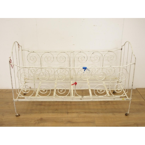 71 - Two cast and wrought iron Cots, one with brass rail