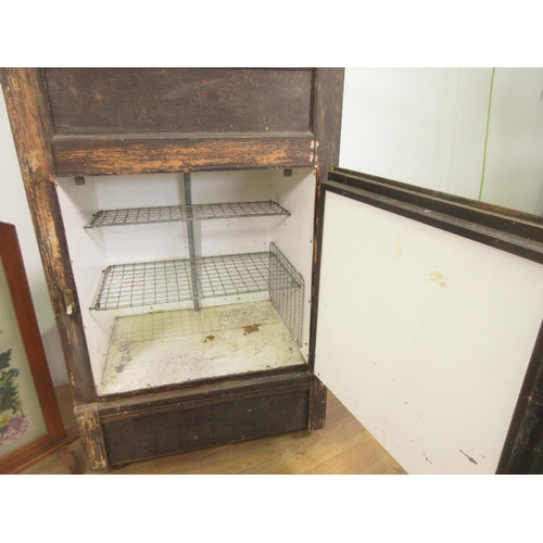 450 - A George Kent wooden Fridge and an oak framed needlework Firescreen