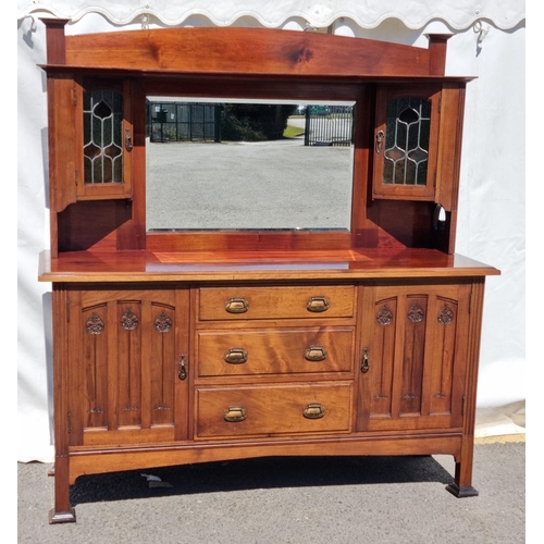 661 - An Art Noveau walnut mirror back Sideboard with a pair of coloured lead glazed doors above two cupbo... 