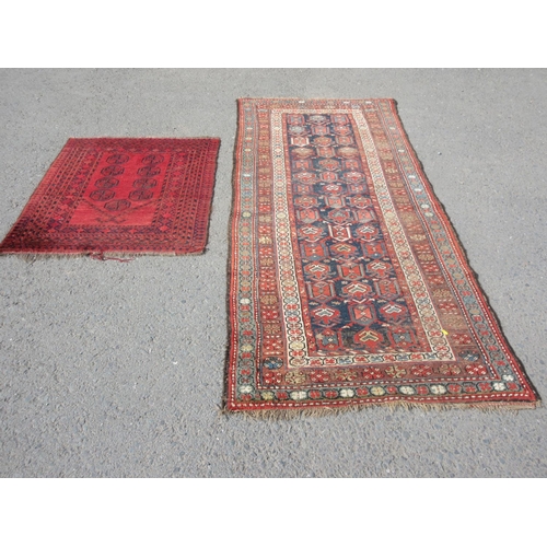 666 - A red ground woollen Rug with blue centre and tramline borders 8ft 3in x 3ft 6in and a red ground Pr... 