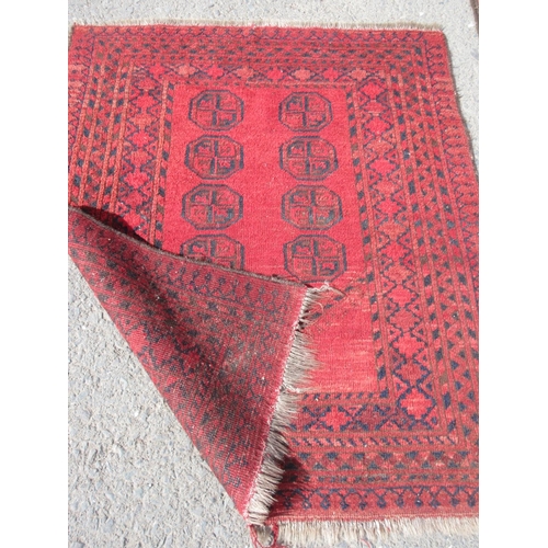 666 - A red ground woollen Rug with blue centre and tramline borders 8ft 3in x 3ft 6in and a red ground Pr... 