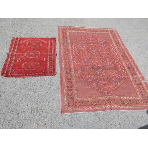 667 - A red ground Rug with stylised leafage design within tramline borders 6ft 3in x 4ft 6in and a half r... 