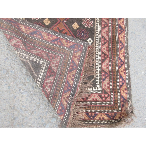 668 - A brown woollen Rug 5ft 3in x 3ft 6in and a Prayer type Rug 4ft 10in x 2ft 10in