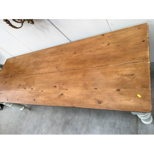 396 - A scrub top Pine Farmhouse Table on green painted base with turned supports 7ft 4in L x 2ft 6in H