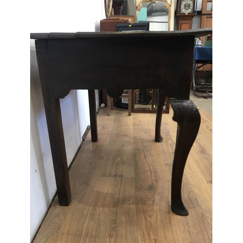 430 - An 18th Century oak Side Table fitted single frieze drawer mounted upon cabriole supports and spade ... 