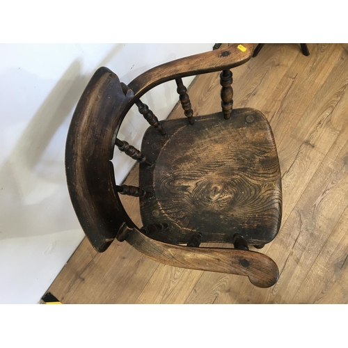 457 - A 19th Century elm seated Smokers Bow Armchair