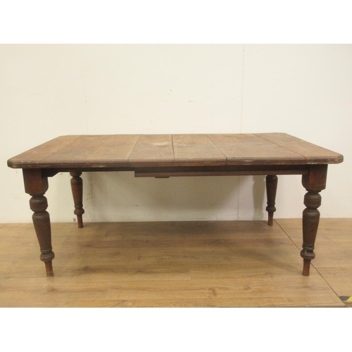 489 - A Victorian oak Dining Table on turned legs 5ft 10in W x 2ft 5in H