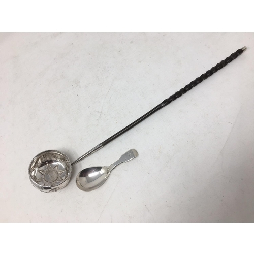 246 - A Georgian silver Toddy Ladle with swag embossing, coin inset bowl and spiral handle, and a Caddy Sp... 