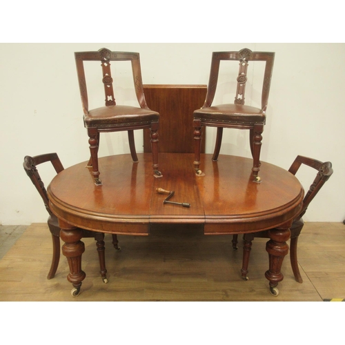 333 - A Victorian mahogany extending Dining Table on heavy turned supports with ceramic casters and two sp... 