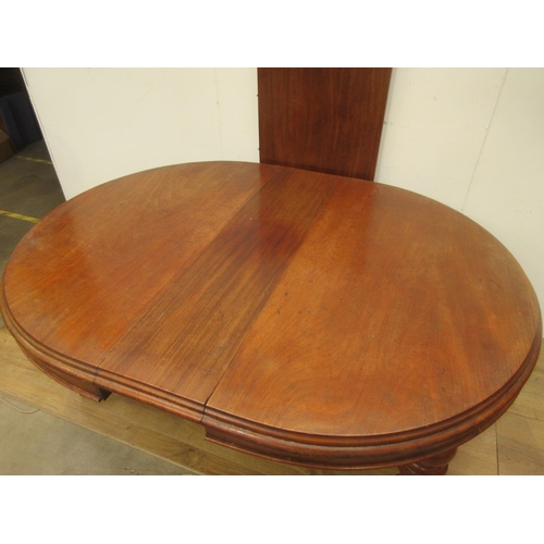 333 - A Victorian mahogany extending Dining Table on heavy turned supports with ceramic casters and two sp... 