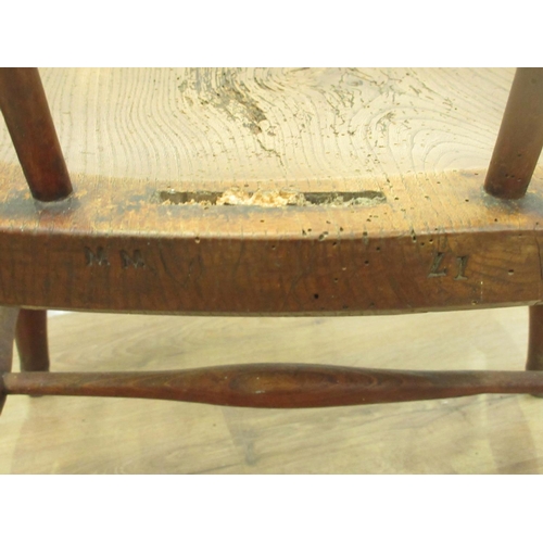 126 - An antique ash and elm Windsor elbow Chair (lacking hoop back)