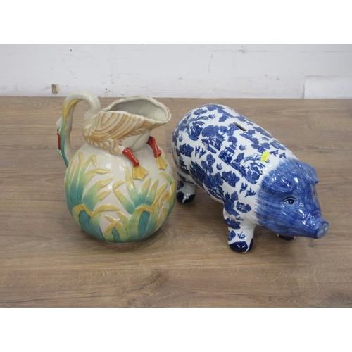 144 - A large ceramic Swan Jug and a blue and white Pig Money Bank