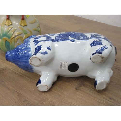 144 - A large ceramic Swan Jug and a blue and white Pig Money Bank