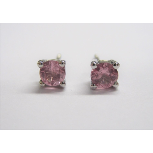 155 - A pair of Pink Sapphire Ear Studs each claw-set round stone in 9ct white gold