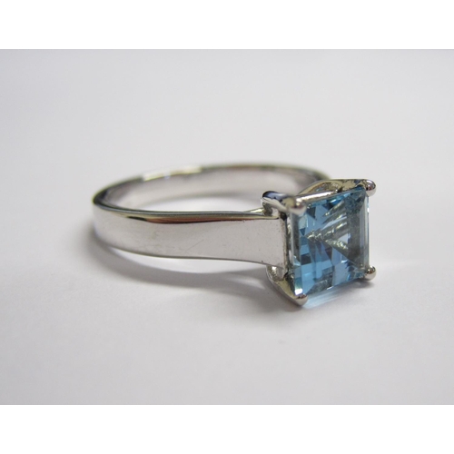 167 - An Aquamarine single stone Ring corner claw-set step-cut stone, 1.29cts, in platinum, ring size M